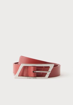 Rolled brown leather belt with a large silver geometric buckle placed on a plain white background.