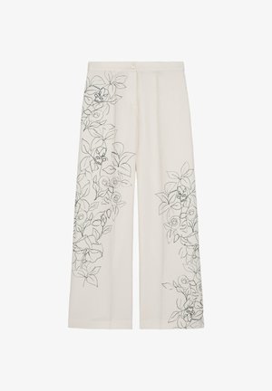 Kremowe spodnie o szerokich nogawkach z czarnym haftem w liniowy kwiatowy wzór na lewej uda i prawej dolnej części nogawki, z przodu zapięcie na guziki i szczegóły szwów.