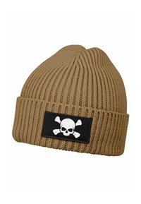 Tan knit beanie with vertical ribbing, featuring a black patch displaying a white skull and crossbones graphic. Soft, textured fabric.