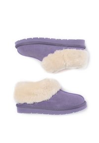 Purple suede slippers with a fluffy beige fur cuff, featuring a textured sole and smooth finish. Designed for comfort and warmth.