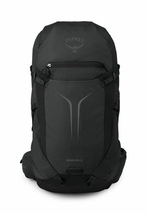 Sac à dos noir Black Osprey Sportlite 30 avec poche avant zippée, sangles latérales et poches rembourrées à la ceinture.