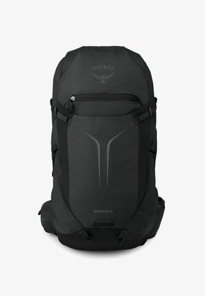 Sac à dos noir Black Osprey Sportlite 30 avec poche avant zippée, sangles latérales et poches rembourrées à la ceinture.