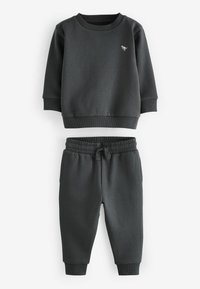 Donkergrijze sweatshirt en bijpassende joggers, gemaakt van zachte stof. De sweatshirt heeft ribgebreide boorden en een ronde hals; de broek heeft een elastische taille en taps toelopende benen.