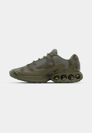 Dark green athletic shoe with a textured upper, lace closure, and a distinctive sole featuring six visible air cushioning units.
