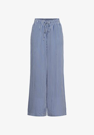 Pantalon large à rayures verticales bleu et blanc avec taille élastique et cordon de serrage à l'avant.