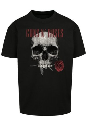 Zwarte katoenen t-shirt met een grijze schedelafbeelding met een rode roos en de tekst "GUNS N’ ROSES" in het rood boven het ontwerp. Korte mouwen.