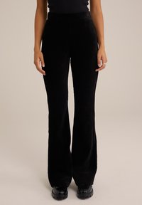 FLARED - Nadrágok - black