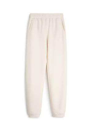 Joggery w kolorze kremowym z elastycznym paskiem w talii, bocznymi kieszeniami i zwężającymi się mankietami. Wykonane z miękkiej, lekkiej tkaniny o gładkiej fakturze.