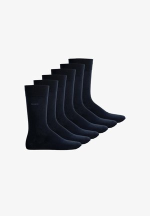 Seis pares de calcetines de un oscuro color azul marino, fabricados con un material suave, presentan una parte superior acanalada y un acabado liso, diseñados para la comodidad y la durabilidad.