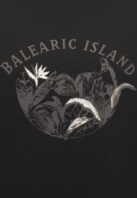 Black fabric featuring a graphic design of leaves and flowers in metallic silver, with the text "BALEARIC ISLAND" above the illustration.