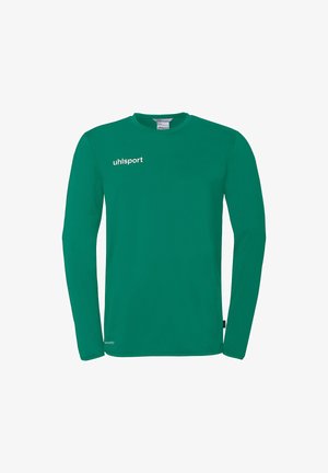 Chemise de sport verte à manches longues avec le logo "uhlsport" sur la poitrine et une petite étiquette blanche "athleteFIT" près de l'ourlet inférieur.