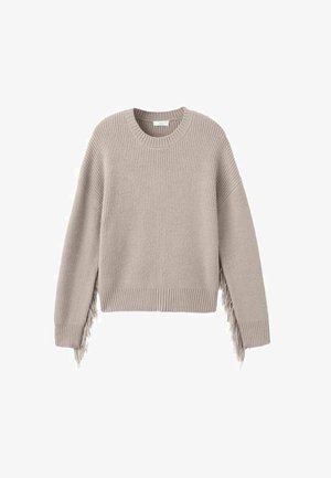 Beige knitted sweater with a textured ribbed pattern, featuring long fringe accents on one side and a round neckline.