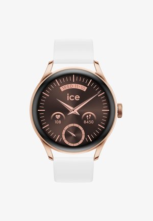 Orologio smartwatch rotondo con quadrante marrone, accenti in oro rosa, cinturino in silicone bianco, che mostra la data e le metriche di fitness.