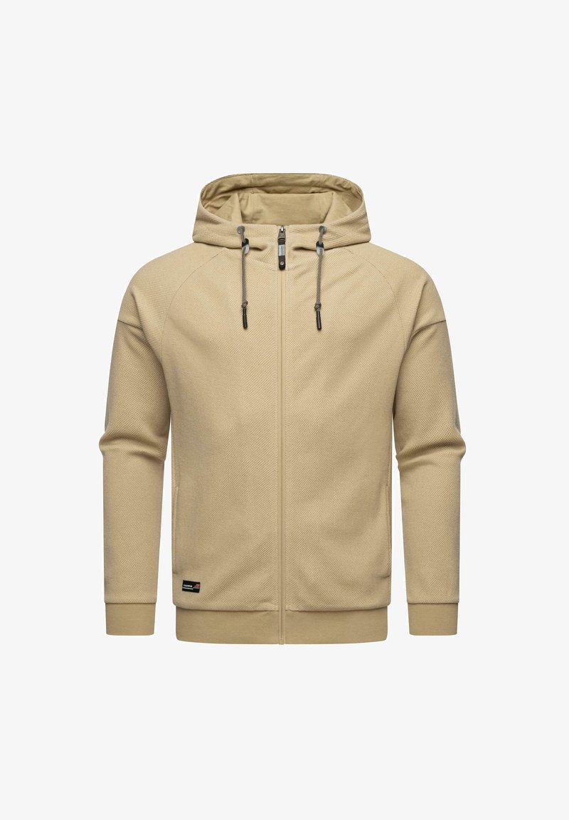 Felpa con zip color beige realizzata in un materiale testurizzato. Presenta un cappuccio con cordino, due tasche laterali e un'etichetta con il logo sull'orlo inferiore.