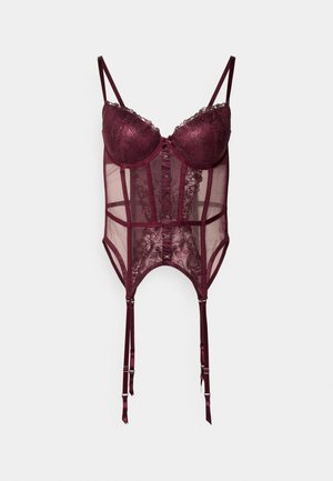 Corsetto in pizzo bordeaux con coppe strutturate, pannelli trasparenti e spalline in satin regolabili. Presenta dettagli in pizzo e chiusure a gancio.