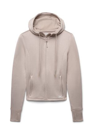 Felpa beige chiaro con zip completa, cappuccio e tasche laterali. Presenta polsini a coste e un tessuto liscio e strutturato.