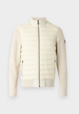 Light-colored puffer jacket with a high collar, quilted front, ribbed knit sleeves, and two side zip pockets. Smooth texture overall.
