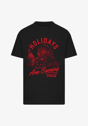 Schwarzes Baumwoll-T-Shirt mit einem roten Grafikmotiv von Santa, der eine Coca-Cola-Flasche hält, mit dem Text "FESTE KOMMEN" darüber.