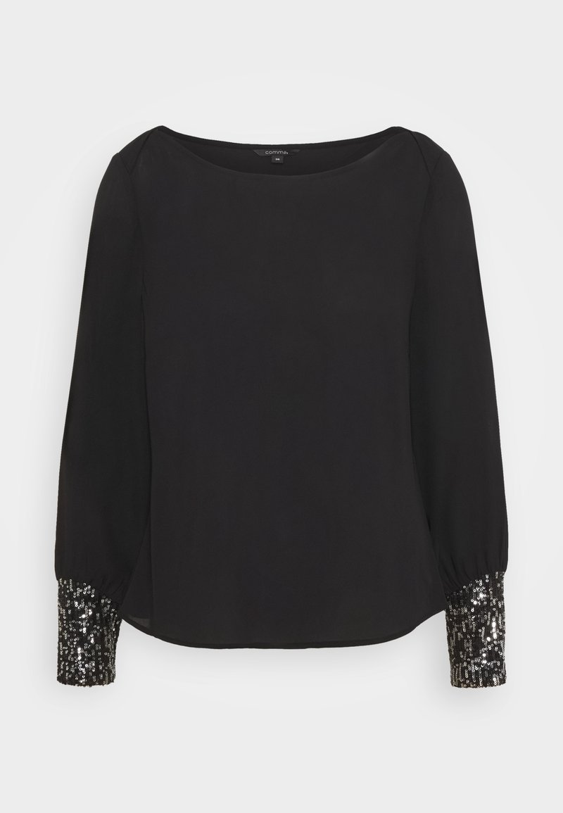 Blusa nera con scollo rotondo e maniche lunghe. I polsini sono decorati con un motivo di paillettes luccicanti, che aggiungono contrasto al tessuto.