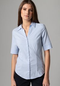 Light blue, short-sleeved button-up shirt with a pointed collar, fitted shape, and slight sheen. Features vertical seams and button front.