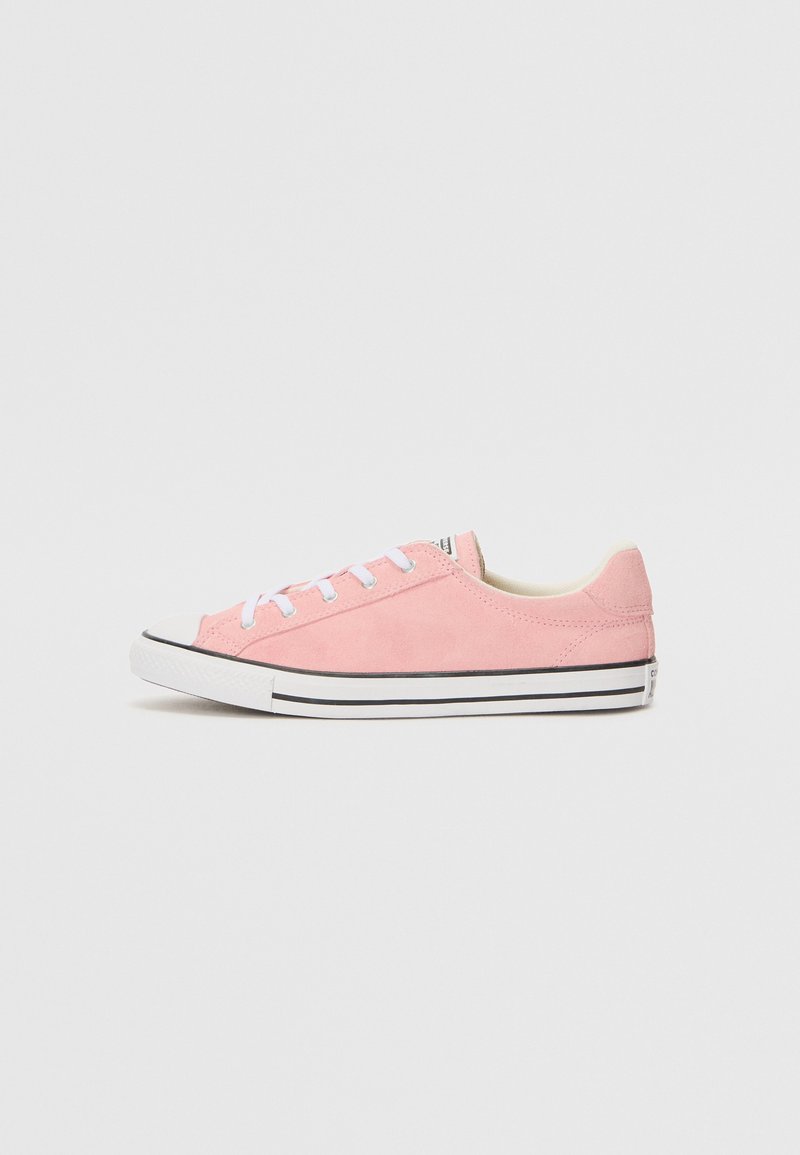 Pink suede sneaker with white laces, rubber toe cap, and black stripe along the sole. Features a low-profile design and smooth texture.