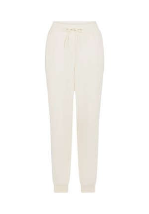 Crème-kleurige joggingbroek van zachte stof. Voorzien van een elastische tailleband met trekkoord en aansluitende boorden bij de enkels.