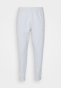 Ljust grå Nike sweatpants med elastiskt midjeband och muddar, prydda med en liten broderad Nike-logga på övre vänstra låret.