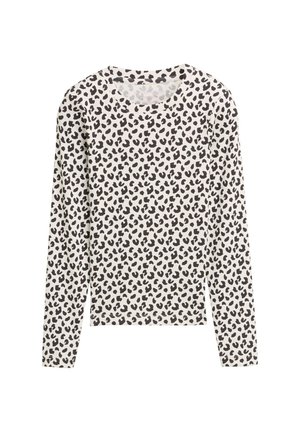 Camicia bianca a maniche lunghe con motivo irregolare a stampa leopardo nera e scollatura rotonda, posata su uno sfondo bianco.