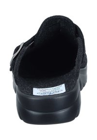 Black felt slip-on shoe with a rounded back, black rubber sole, and a metallic buckle accent on the side. Labels visible inside.