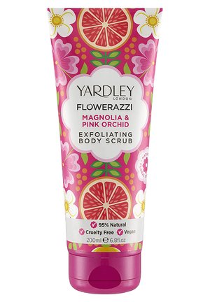 Yardley Flowerazzi exfoliating body scrub in a pink tube, featuring floral graphics, citrus slices, and text indicating magnolia and pink orchid scent.