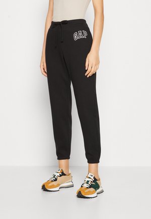 HERITAGE - Tracksuit bottoms - true black