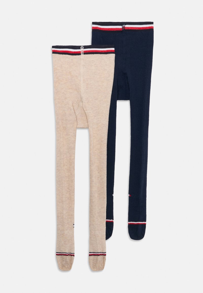 Collant en maille beige et marine, avec des ceintures rayées contrastantes aux accents rouge et blanc et une texture côtelée.