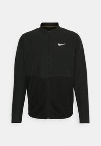 Black Nike jacket featuring a zip-up front, high collar, and mesh paneling at the bottom. Includes a small white swoosh logo on the chest.