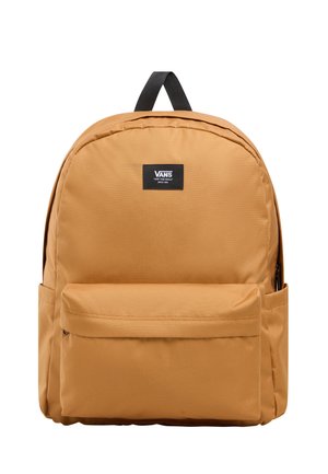Vans-reppu poltettuna oranssina, valmistettu kestävästä kankaasta. Pyöreä muoto, etupuolella vetoketjullinen tasku, logo-etiketti ylhäällä.
