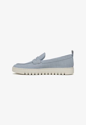 Light blue slip-on shoe made of textured fabric, featuring a subtle strap detail and a thick white rubber sole with ridges.