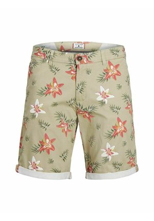 Short beige pour homme avec un imprimé floral rouge, blanc et vert, doté d'une fermeture par bouton et d'ourlets retroussés.