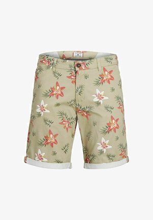 Short beige pour homme avec un imprimé floral rouge, blanc et vert, doté d'une fermeture par bouton et d'ourlets retroussés.