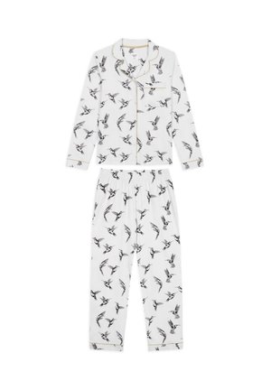 White pajama set with black bird prints. Long-sleeve top features a collar and gold piping; pants have an elastic waistband.