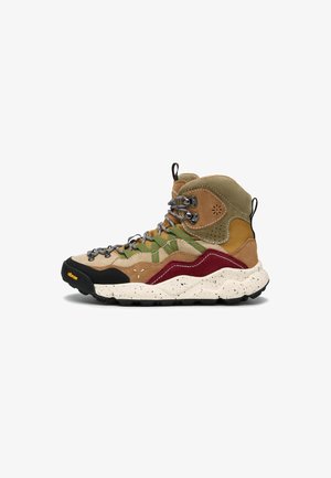 Lace-up hiking boot featuring a mix of tan and olive suede with burgundy accents, a speckled cream sole, and metallic hardware. Textured fabric and vibrant laces.