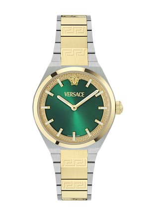 Zlatna in srebrna zapestna ura Versace z zelenim številčnico, zlatimi urami markatorji, emblemom Meduze in vzorčasto kovinsko zapestnico.