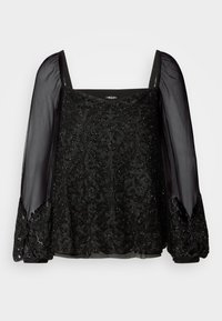 Schwarze Bluse mit quadratischem Ausschnitt und transparenten, langen Ärmeln. Verfügt über aufwendige Perlenstickerei und -verzierungen am Oberteil. Elegante Textur.