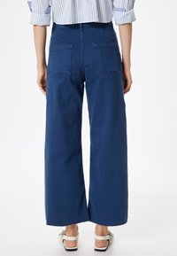 Koton WIDE LEG - Flared Jeans - dark blue