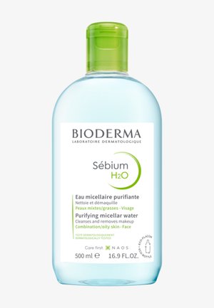 Flacon transparent de Bioderma Sébium H2O eau micellaire purifiante pour peau mixte/grasse du visage, 500 ml avec bouchon à clapet vert.