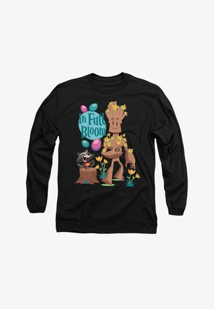 Black long-sleeve shirt featuring a cartoon character resembling a tree with flowers, a raccoon, and the text "In Full Bloom" in vibrant colors.
