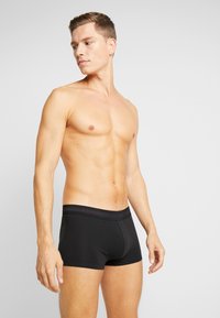 Calvin Klein Underwear LOW RISE TRUNK STRETCH 3 PACK - Cuecas boxer - black