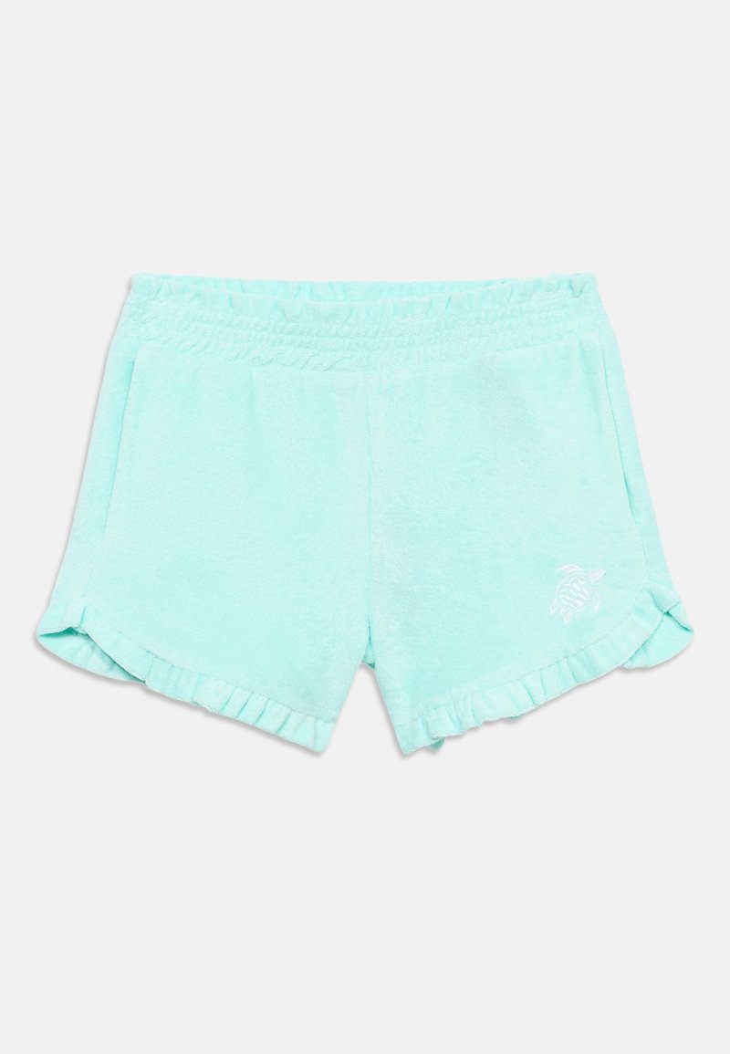Ανοιχτό μπλε σορτς από πετσέτα με ελαστική μέση, πλαϊνές τσέπες, βολάν στο τελείωμα και μικρό κεντητό λογότυπο χελώνας στο αριστερό πόδι.