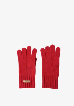 Rote Wollhandschuhe mit gerippten Bündchen, im fingerlosen Design. An dem Handgelenk ist ein kleines rechteckiges Etikett mit Markendetails angenäht.