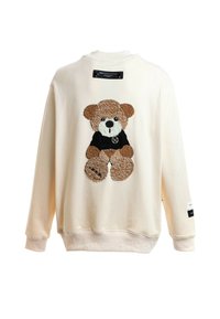 Sudadera color crema con un aplique de osito de peluche texturizado en marrón y negro en la parte posterior, con puños y dobladillo acanalados.