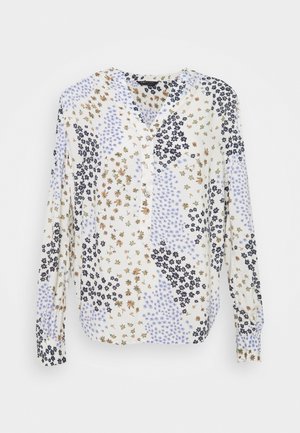 Wit blouse met lange mouwen, een V-hals en een knoopsluiting aan de voorkant, met een gemengd bloemenpatroon in zwart, bruin en lichtpaars.