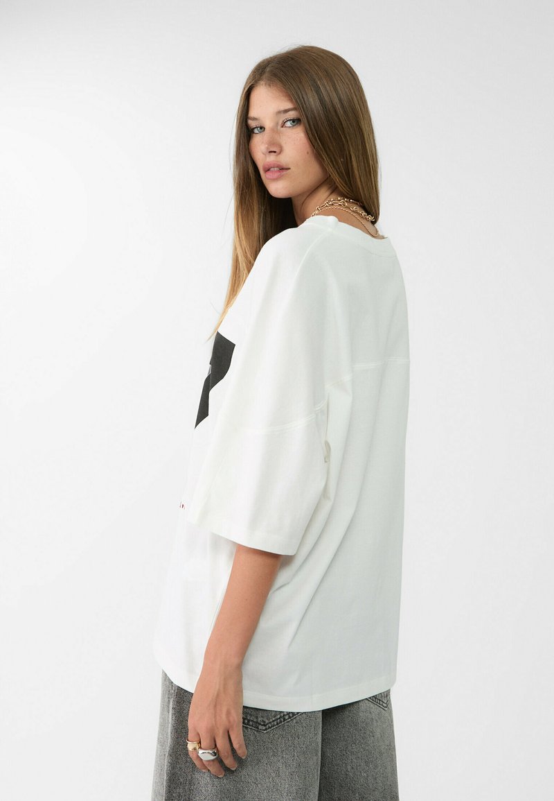 Haut Blanc Stradivarius Coton Motifs & Messages - Taille M - Neuf Avec étiquettes